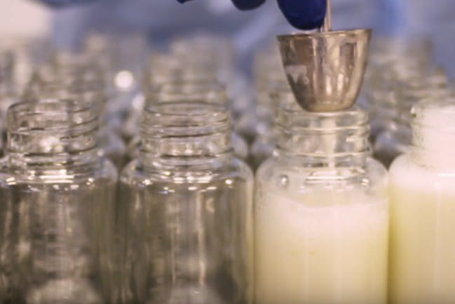 Glass containers with milk in them.